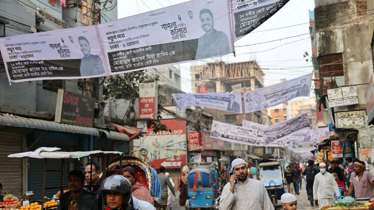 Election campaign banners of candidates hang over the streets ahead of the national election in Dhaka