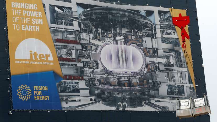A crane loads equipments at the construction site of the International Thermonuclear Experimental Reactor (ITER) in Saint-Paul-lez-Durance