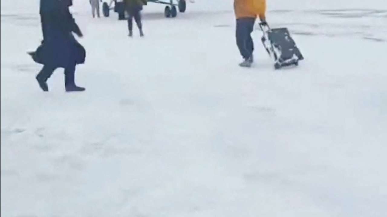 Tourists stranded by avalanches lifted to safety by helicopter, in Burqin County