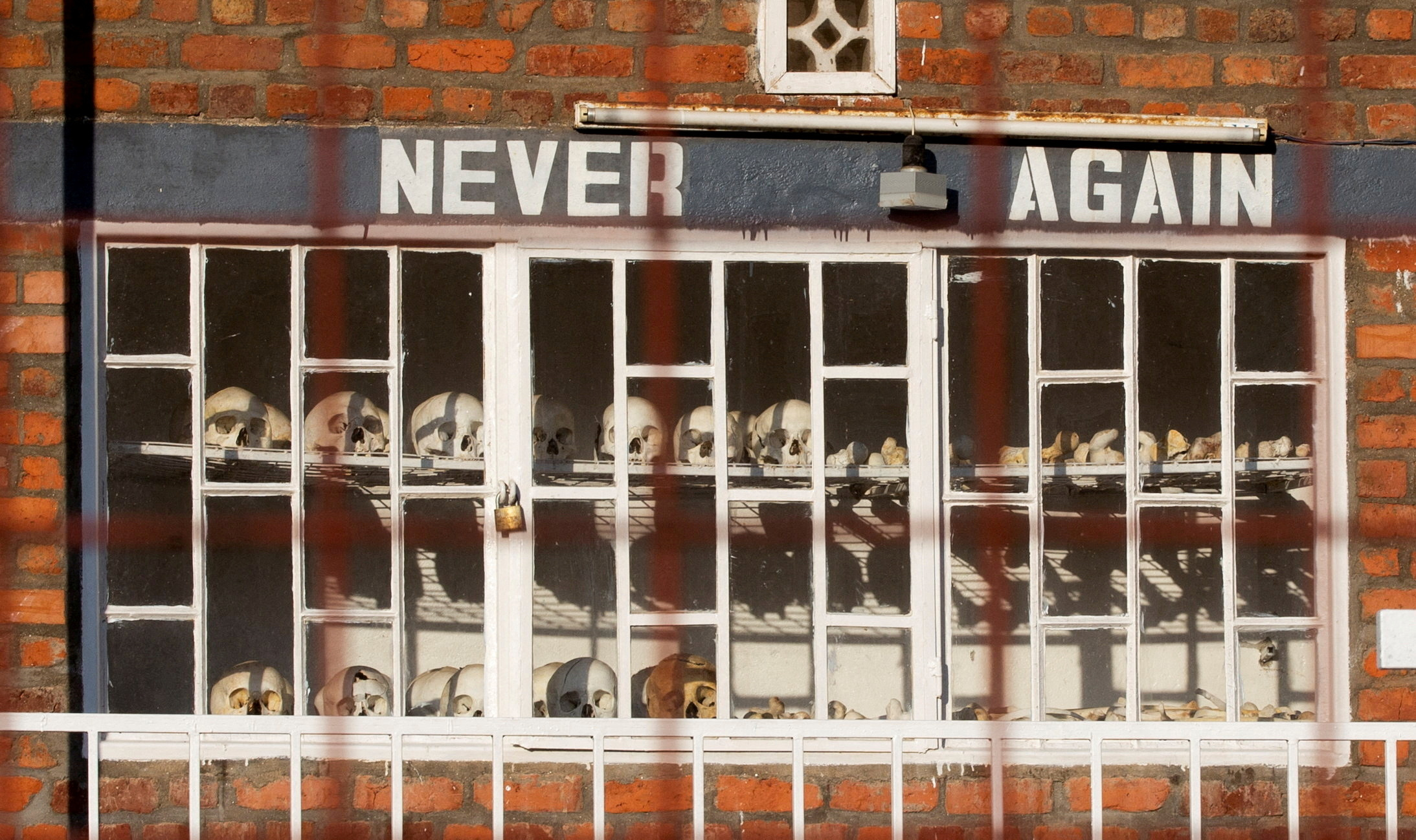 FILE PHOTO: Skulls of people who died during the 1994 Rwandan genocide are arranged and locked outside the St. Pierre Catholic Church, in Kibuye, Karongo city center, Karongi distric