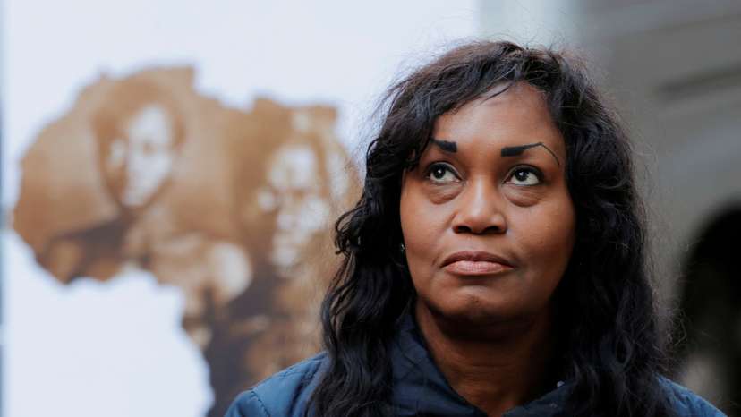 FILE PHOTO: Tamara Lanier listens as her lawyer speaks to the media outside of the Harvard Club in New York
