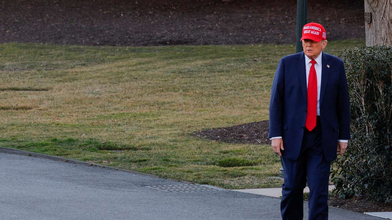 U.S. President Donald Trump speaks with members of the media on the South Lawn before boarding Marine One at the White House