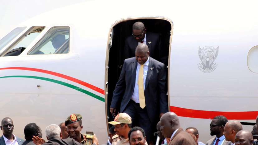 FILE PHOTO: South Sudan's ex-vice president and former rebel leader Riek Machar exits a plane as he arrives to Juba to meet President Salva Kiir, at the Juba international airport