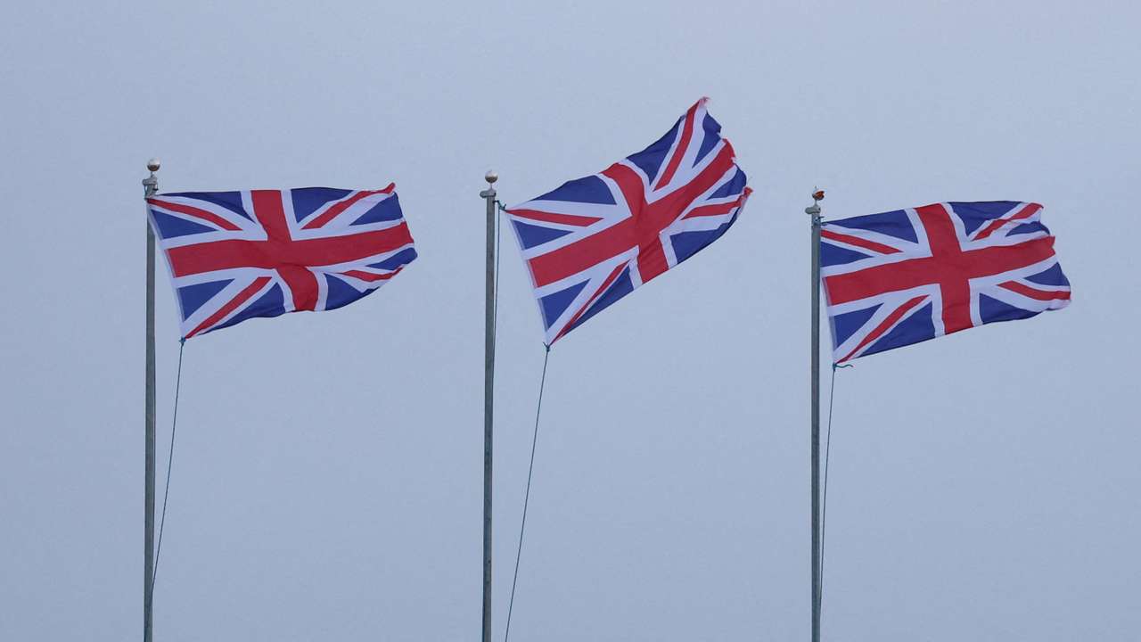 Union Jack flags blow in strong winds brought by Storm Lilian outside Fort Perch Rock in New Brighton, Britain