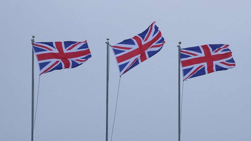 Union Jack flags blow in strong winds brought by Storm Lilian outside Fort Perch Rock in New Brighton, Britain