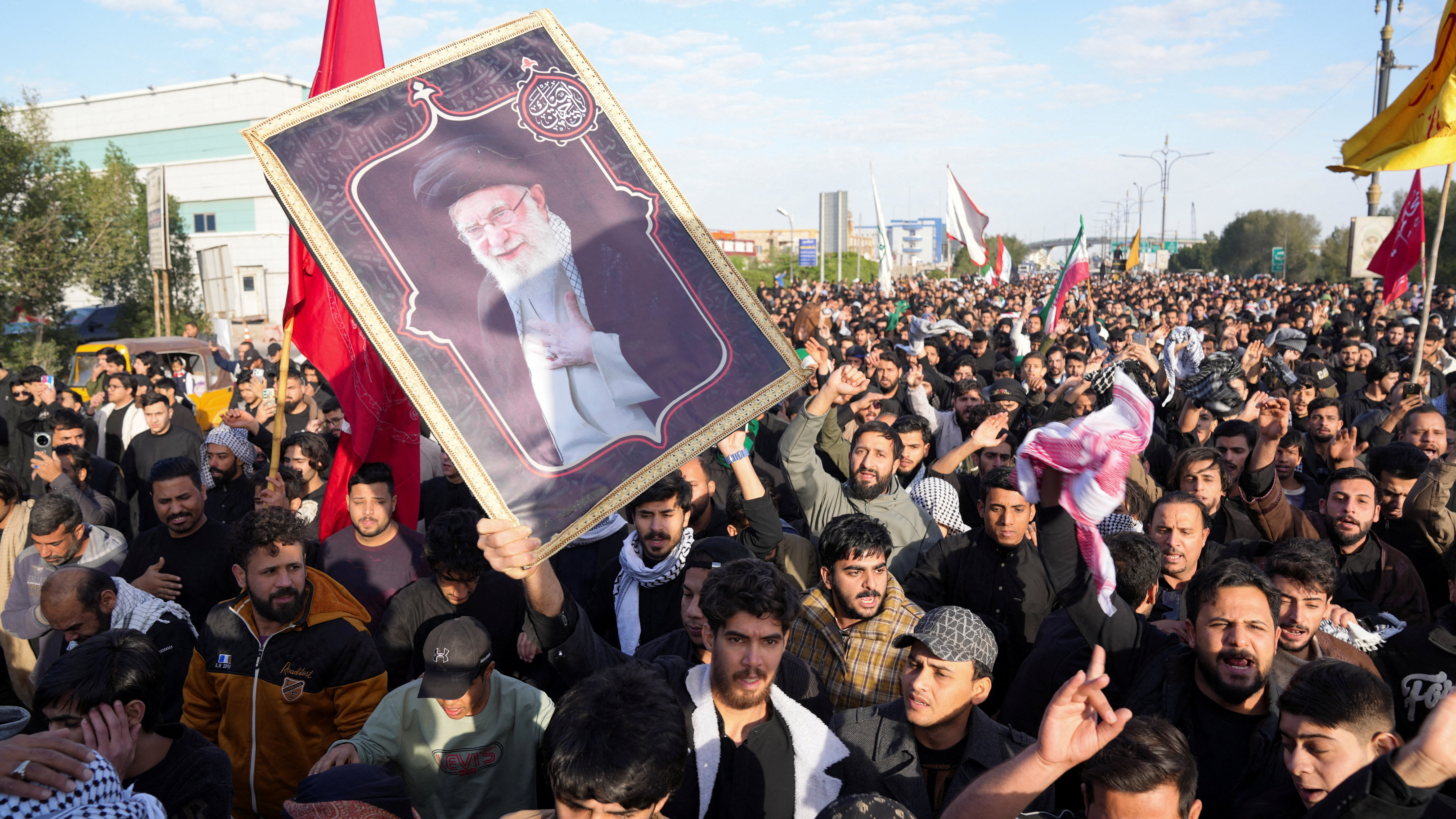 People march after Iran’s Supreme Leader Ayatollah Ali Khamenei was killed in Israeli and U.S. strikes, in Basra