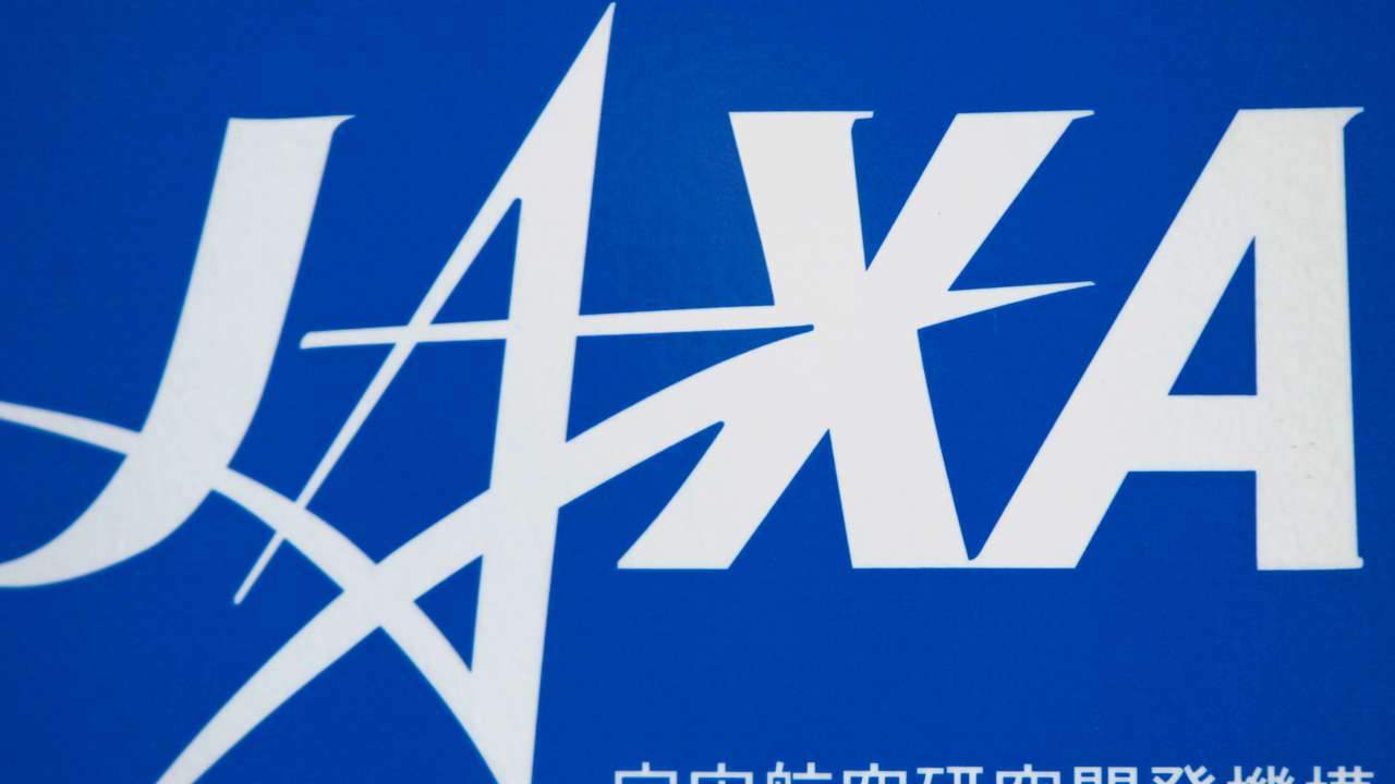 A JAXA logo is seen at the JAXA Chofu Aerospace Center Aerodrome Branch in Tokyo