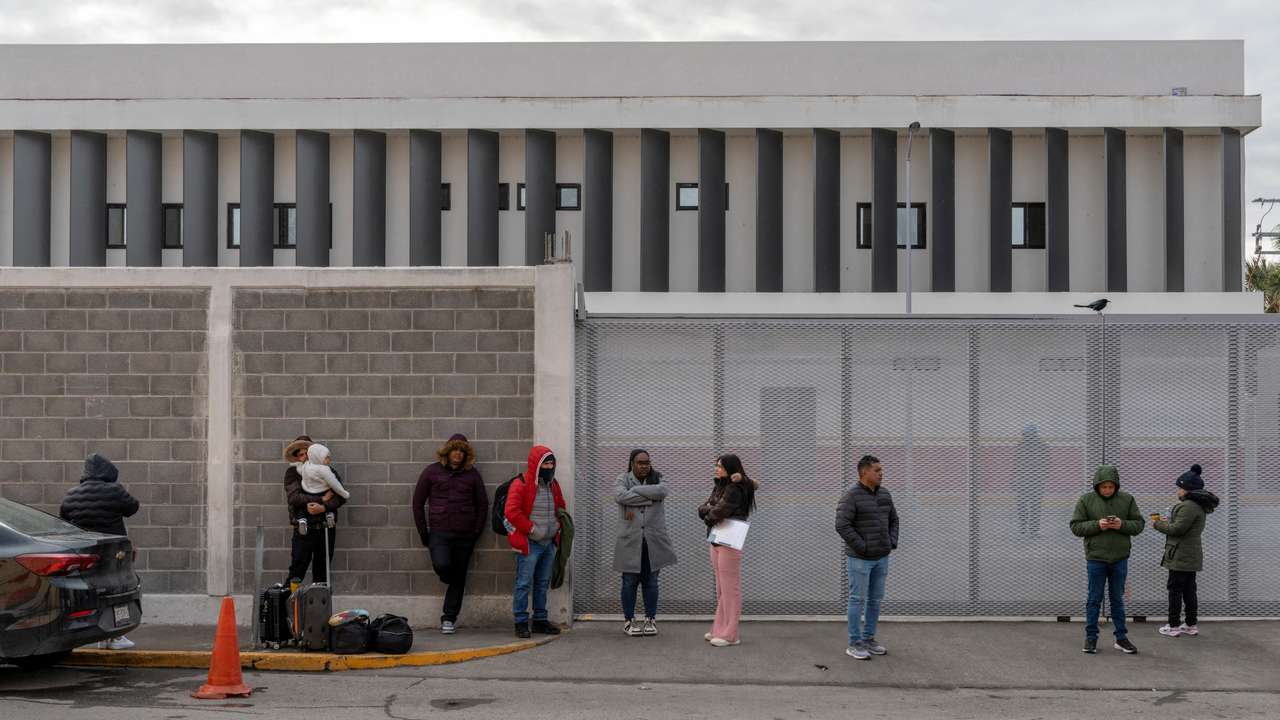 FILE PHOTO: Asylum seekers gather for information outside of the National Institute of Migration (INM) office in Piedras Negras, Mexico