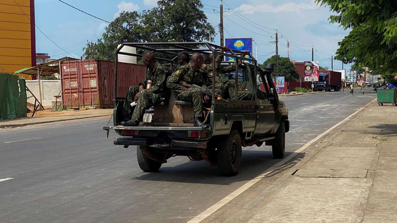 Guinean security forces patrol on the streets after armed men spring Guinea's ex-junta leader Moussa Dadis Camara out of prison in Conakry