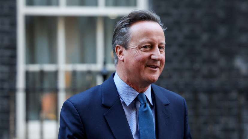 Britain's former Prime Minister and newly appointed Foreign Secretary David Cameron walks outside 10 Downing Street in London