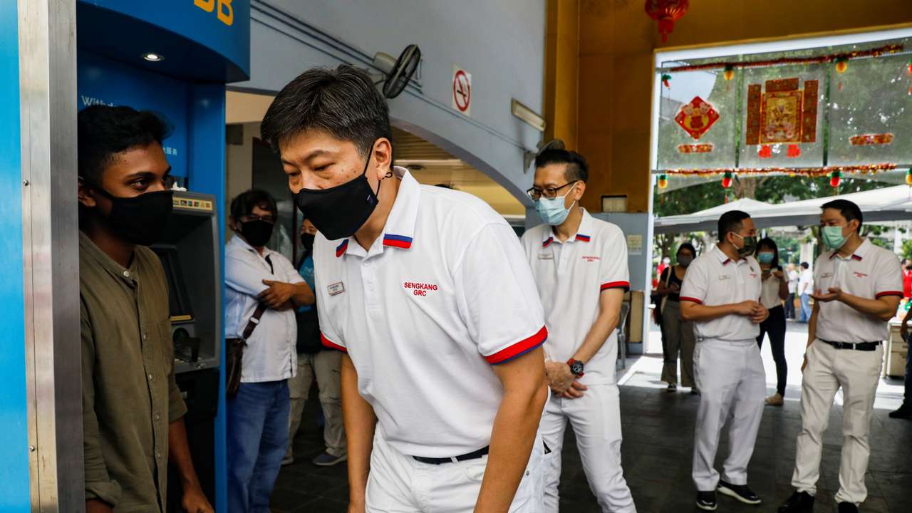 Ng Chee Meng of the People's Action Party (PAP) participates in a walkabout ahead of the general election in Singapore