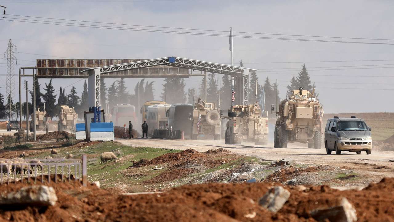 FILE PHOTO: Islamic State detainees head from Syria towards Iraq, in Qamishli