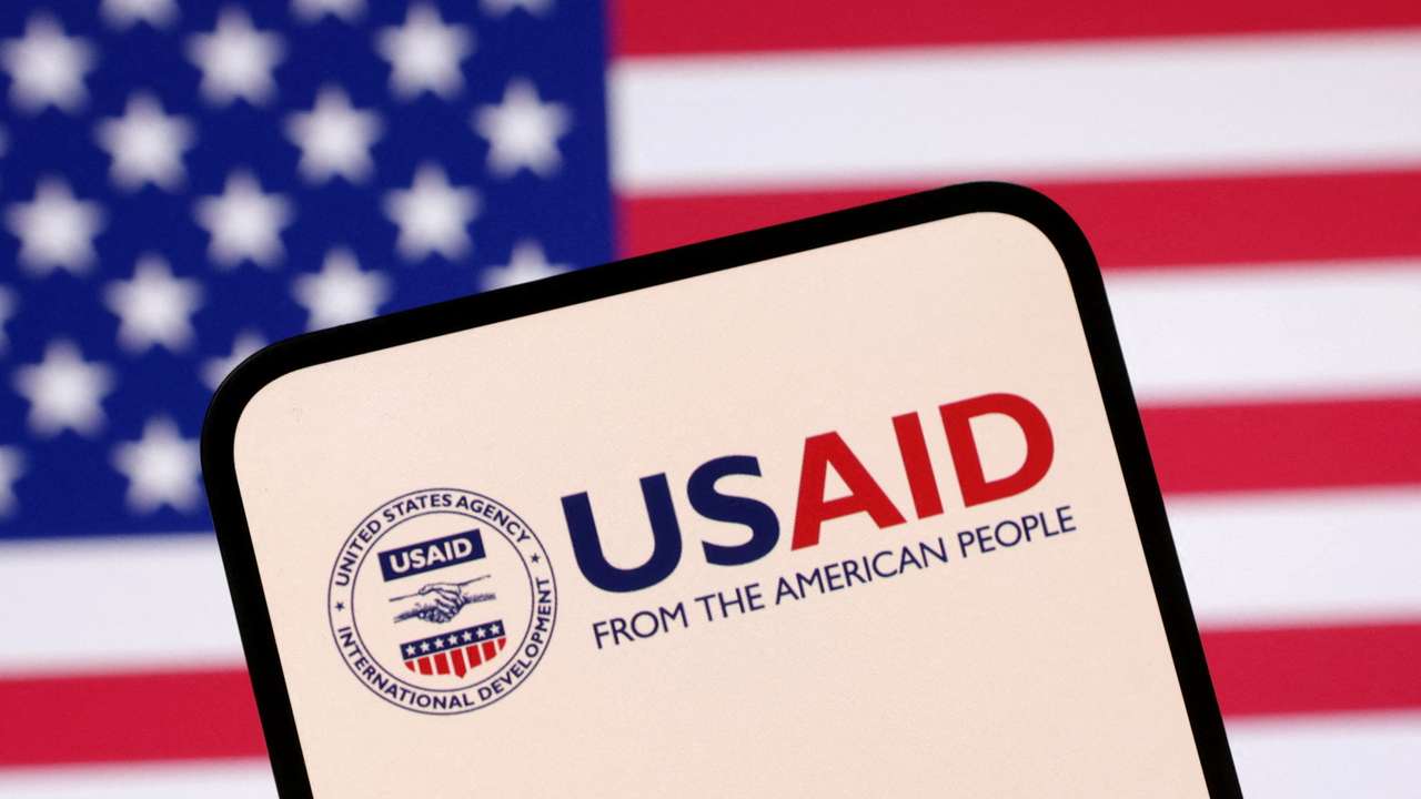 FILE PHOTO: Illustration shows USAID logo and U.S. flag