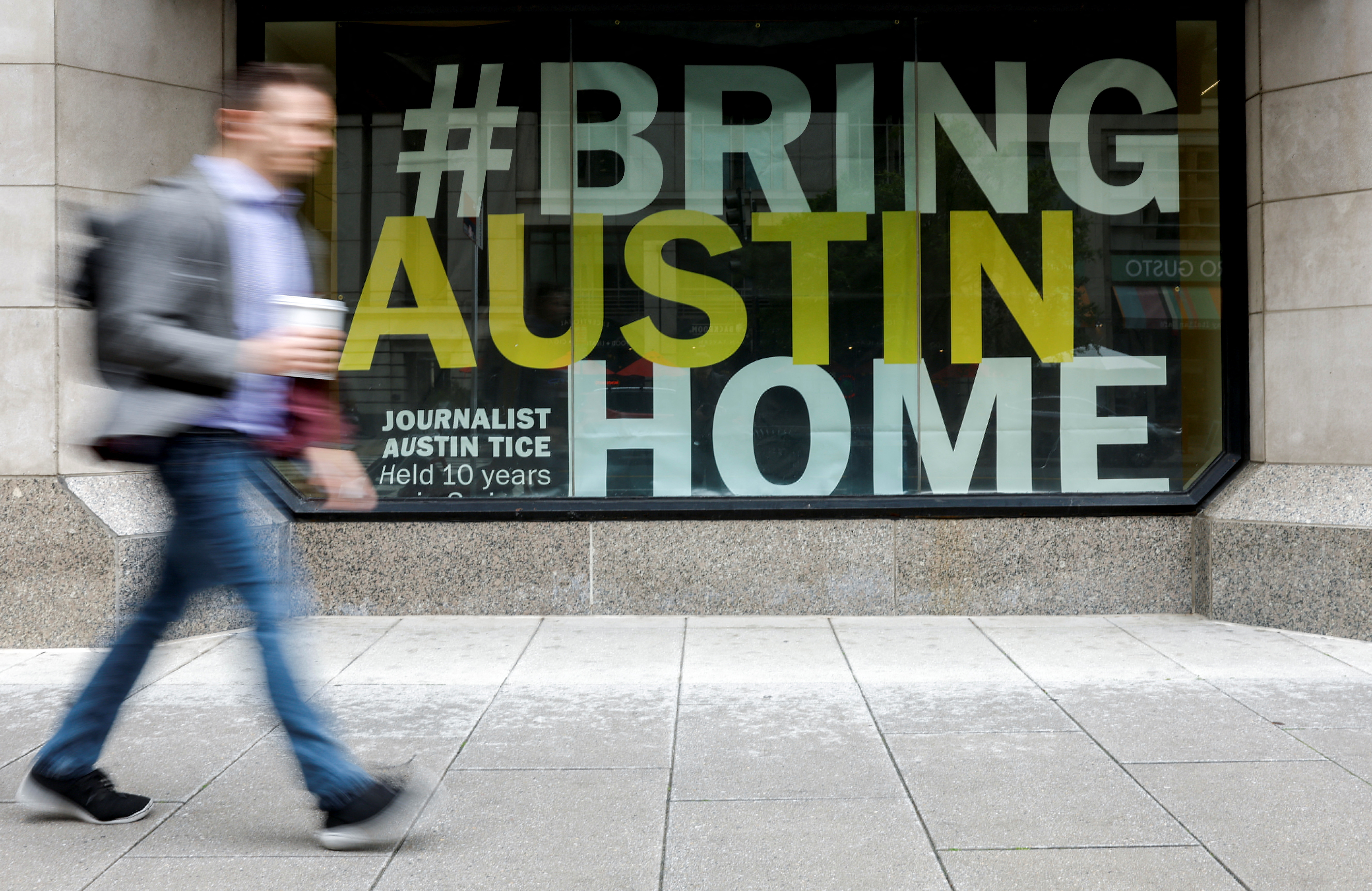 Banner for journalist Tice, who disappeared while reporting in Syria in 2012, hangs outside the National Press Club building in Washington