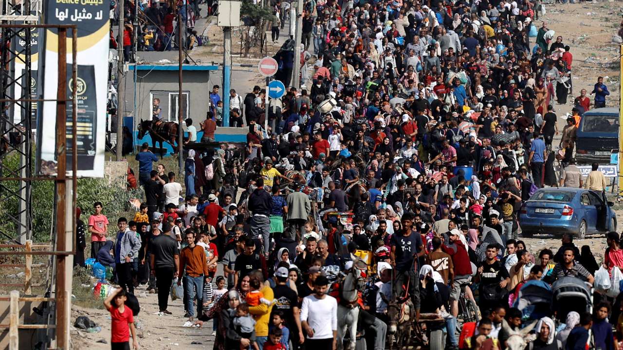Palestinians flee north Gaza towards the south, amid the ongoing conflict between Israel and Palestinian Islamist group Hamas, in the central Gaza Strip