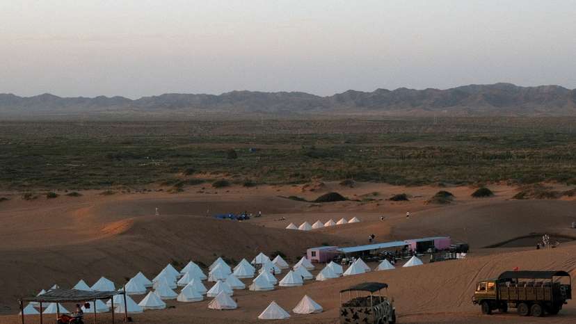 FILE PHOTO: Tourists on desert safari trips stay in tents in Tengger Desert in Ningxia