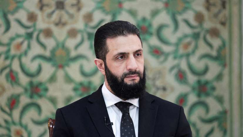 FILE PHOTO: Syria’s interim President Ahmed al-Sharaa attends an interview with Reuters