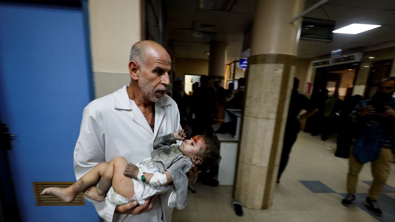 A Palestinian child wounded in an Israeli strike is assisted at Nasser hospital in Khan Younis