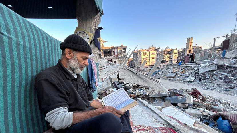 Gaza family breaks Ramadan fast on the rubble of their destroyed house, in Beit Lahia in the northern Gaza Strip