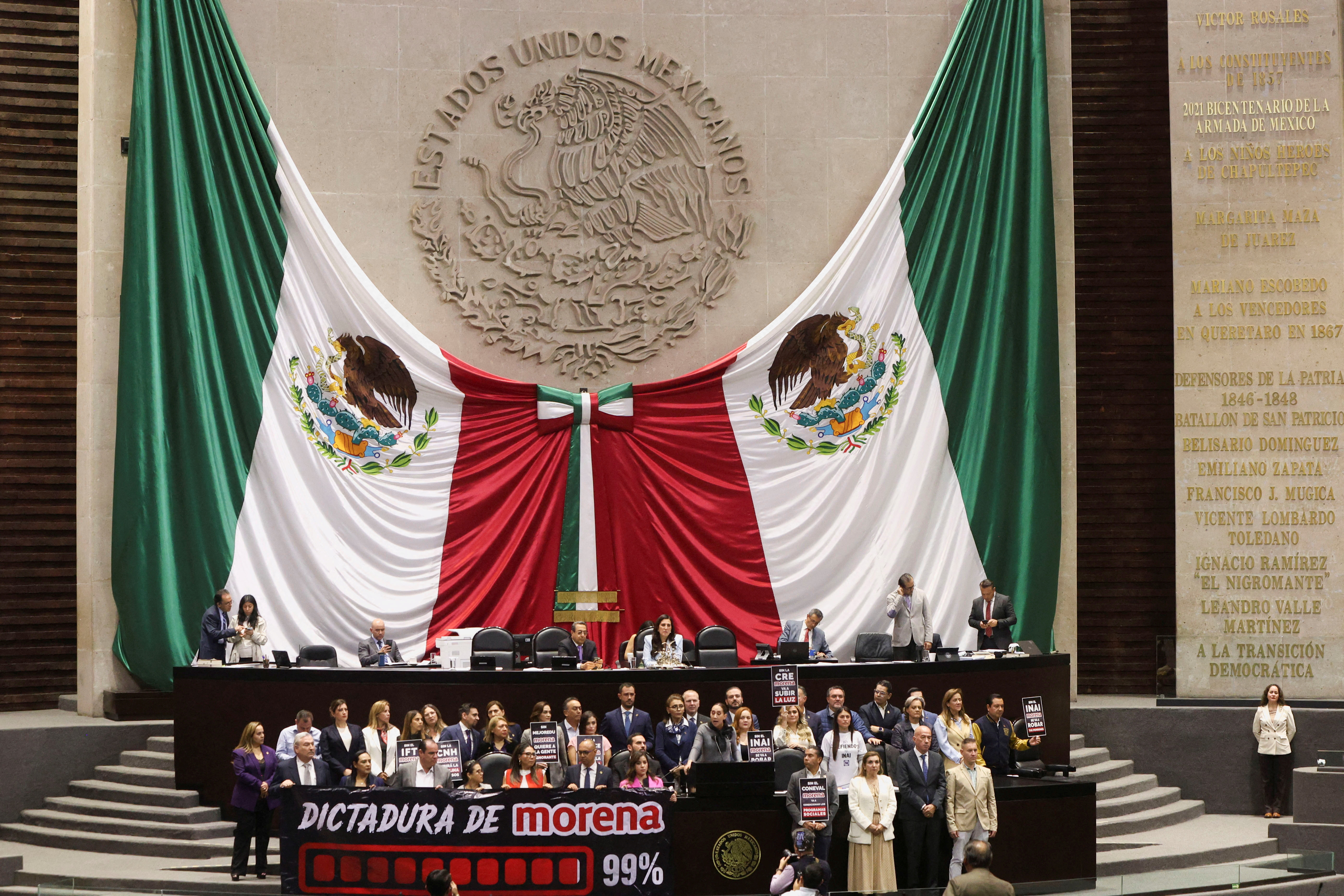 Congress members oppose a reform during a session, in Mexico City