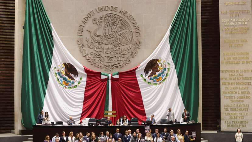 Congress members oppose a reform during a session, in Mexico City