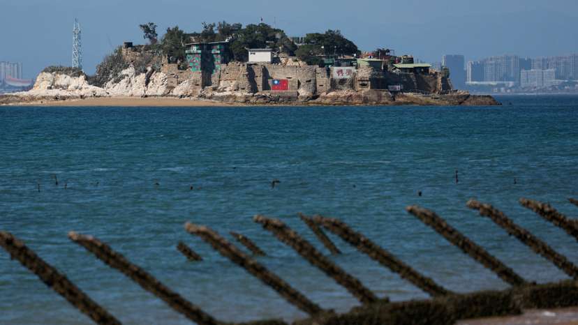 FILE PHOTO: Shiyu or Lion Islet, which is part of Kinmen County, one of Taiwan's offshore islands, is pictured with China's Xiamen in the background, in Kinmen