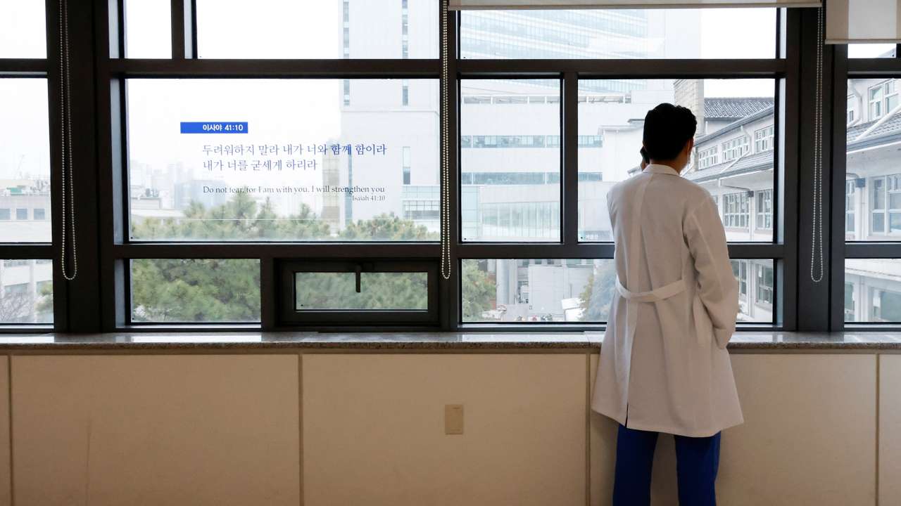 A medical worker uses a mobile phone at Severance Hospital