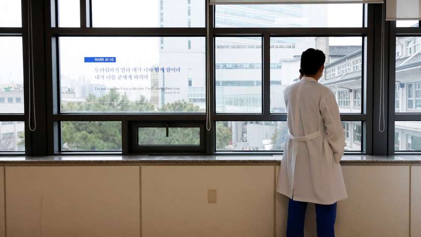 A medical worker uses a mobile phone at Severance Hospital