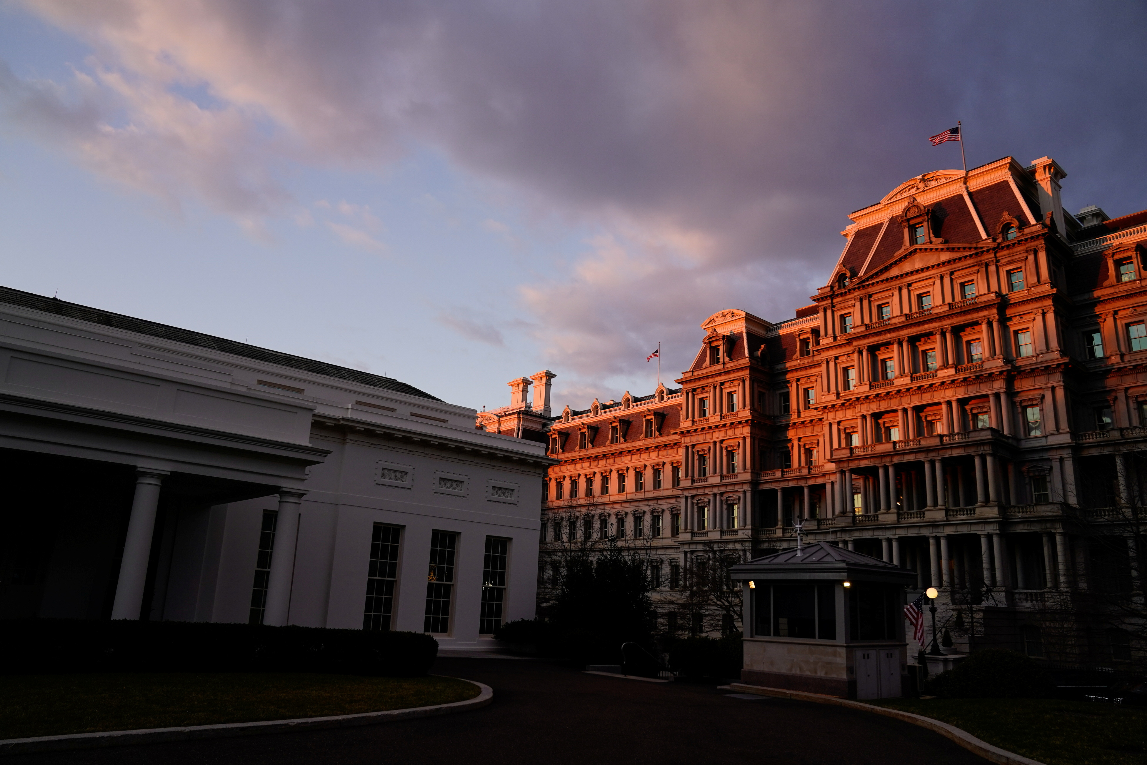 The West Wing of the White House and the Eisenhower Executive Office Building are seen at sunrise during U.S. President Biden and Vice President Harris' first week in office in Washington