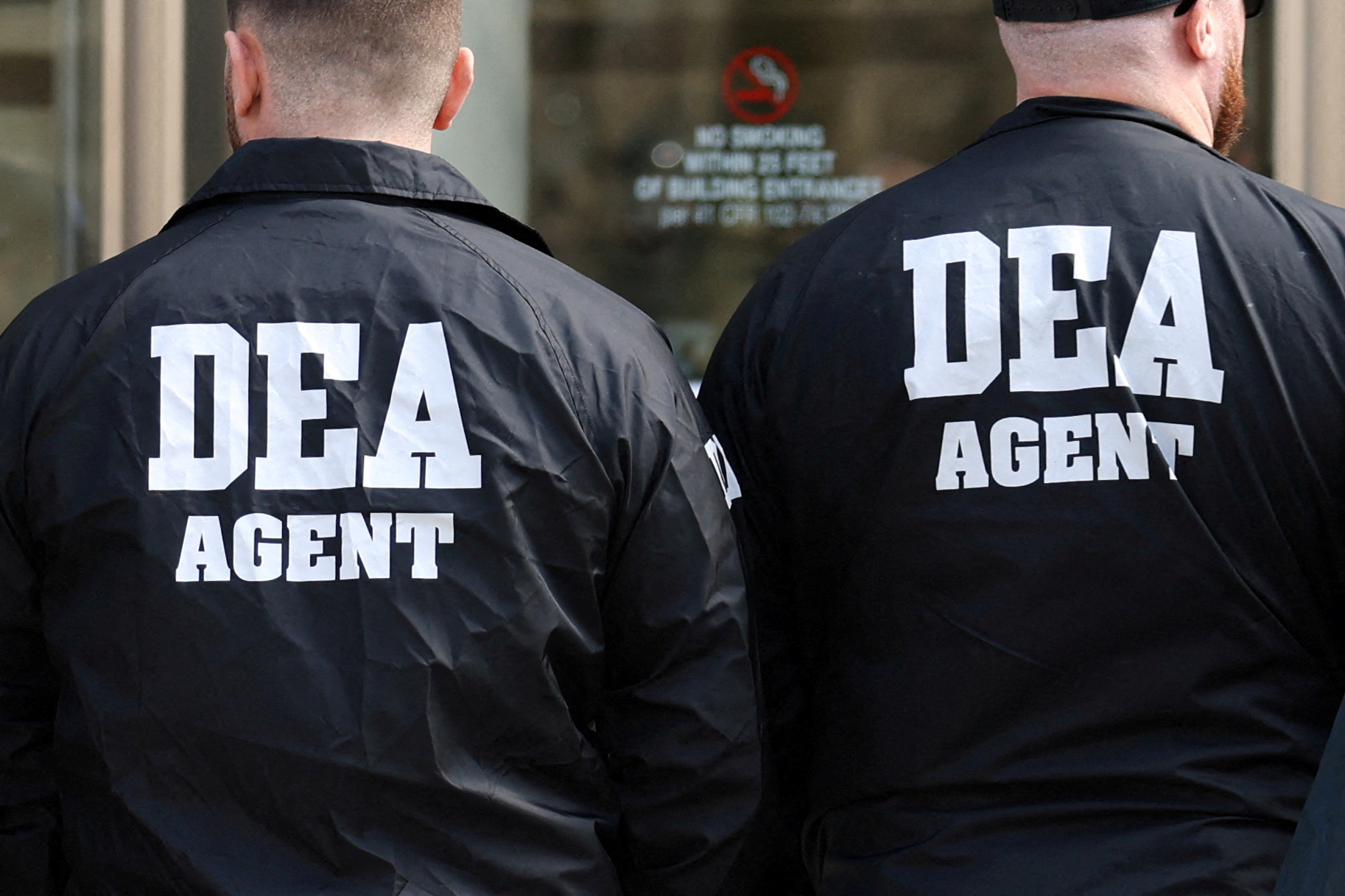 Members of the Drug Enforcement Administration (DEA) stand outside the Brooklyn Federal Courthouse on the day of a hearing for Guadalajara Cartel co-founder Rafael Caro Quintero in Brooklyn, New York