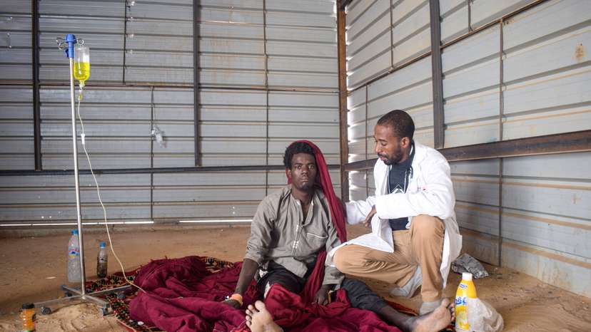 Dr Moussa Bagayoko examines Moussa Diallo, who suffers from diphtheria, at a local clinic in Tinzaouaten