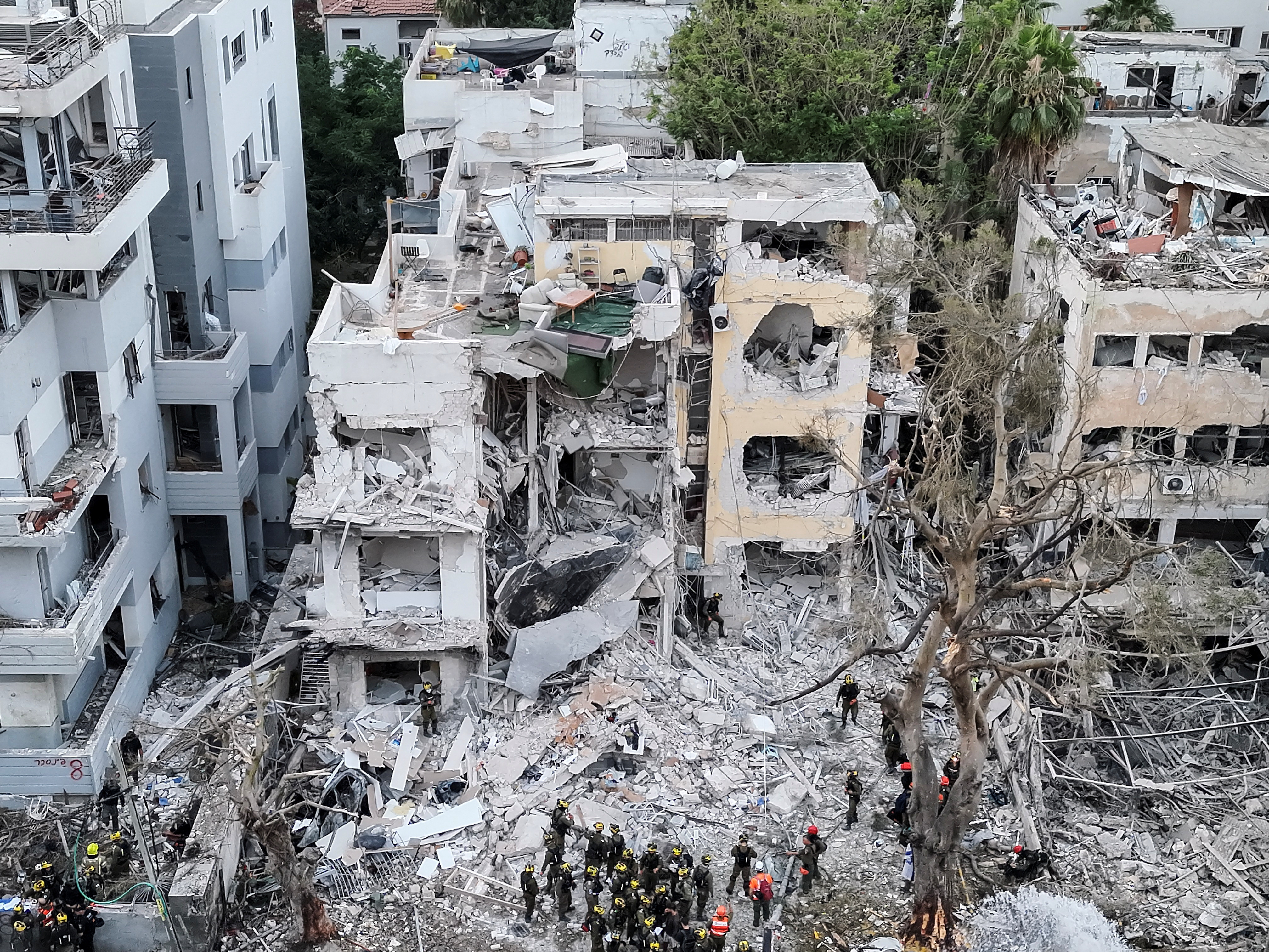 A drone photo shows the damage over residential homes at the impact site following missile attack from Iran on Israel, in Tel Aviv