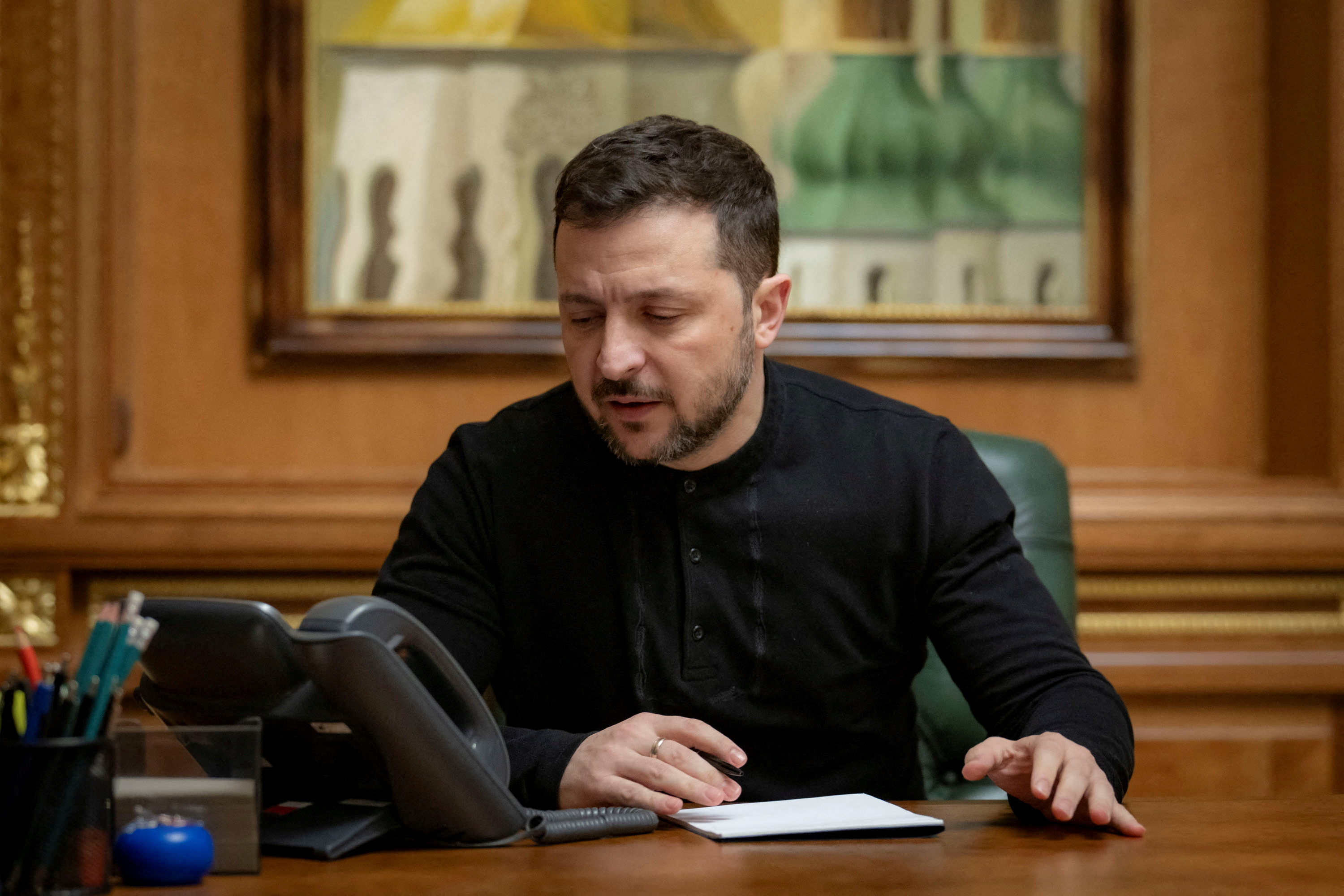 FILE PHOTO: Ukraine's President Zelenskiy speaks with U.S. President Trump via a phone line in Kyiv