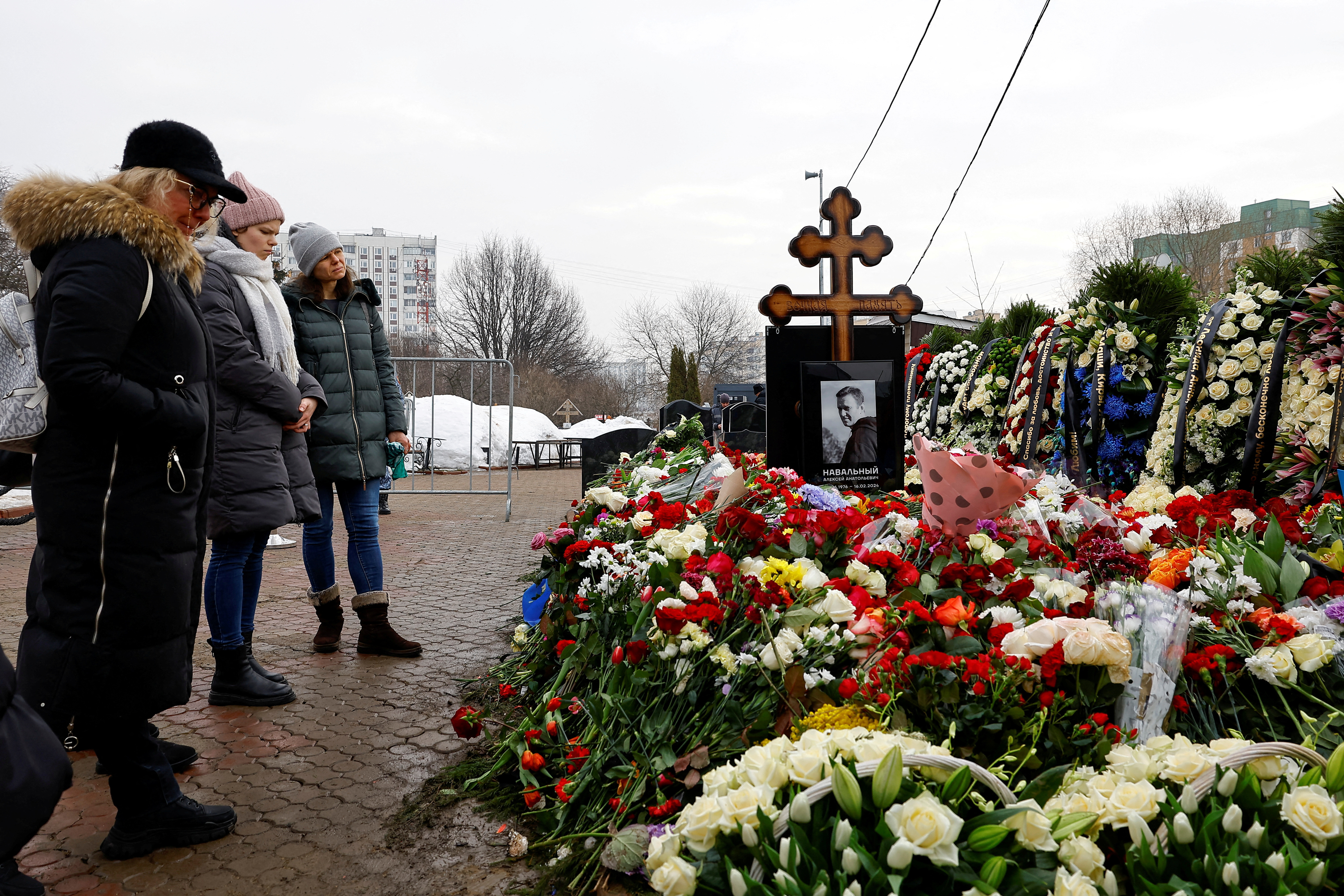 FILE PHOTO: Mourners come to grave of Russian opposition leader Alexei Navalny