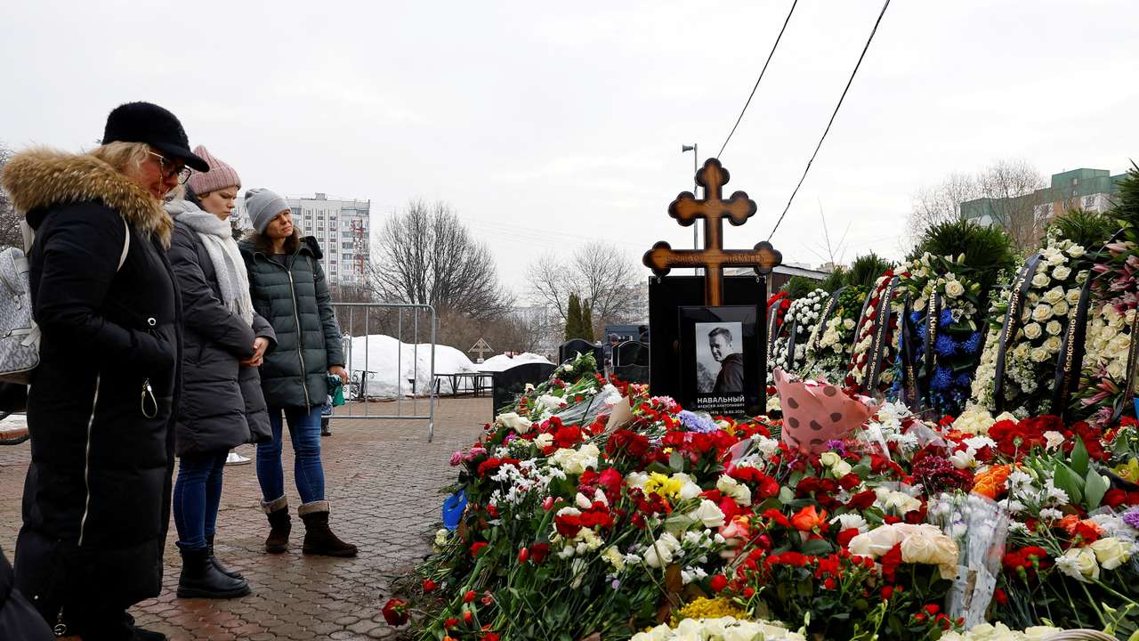 FILE PHOTO: Mourners come to grave of Russian opposition leader Alexei Navalny