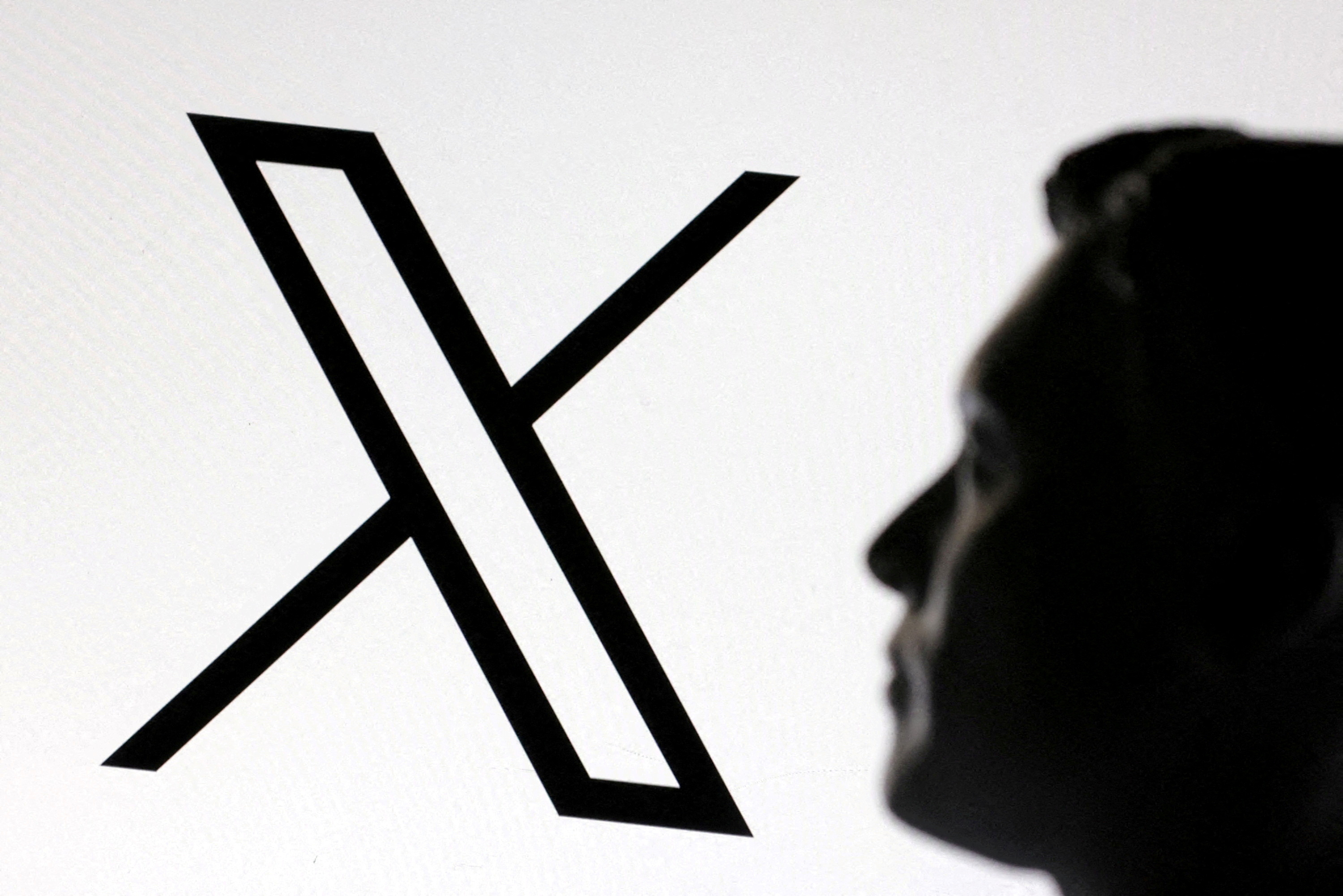 FILE PHOTO: Illustration shows 3D-printed miniature model of Elon Musk and X logo