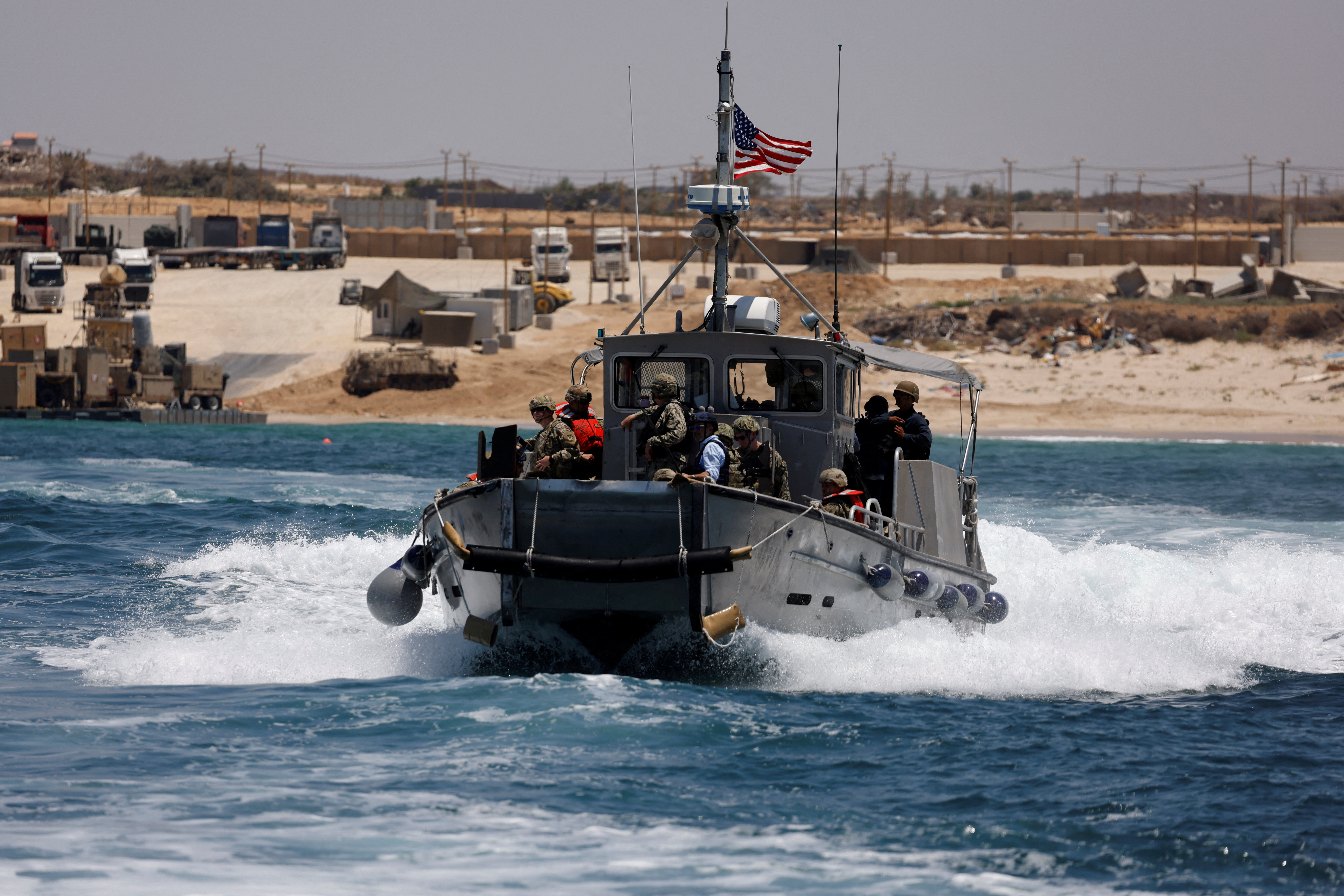 A boat sails near the Trident Pier