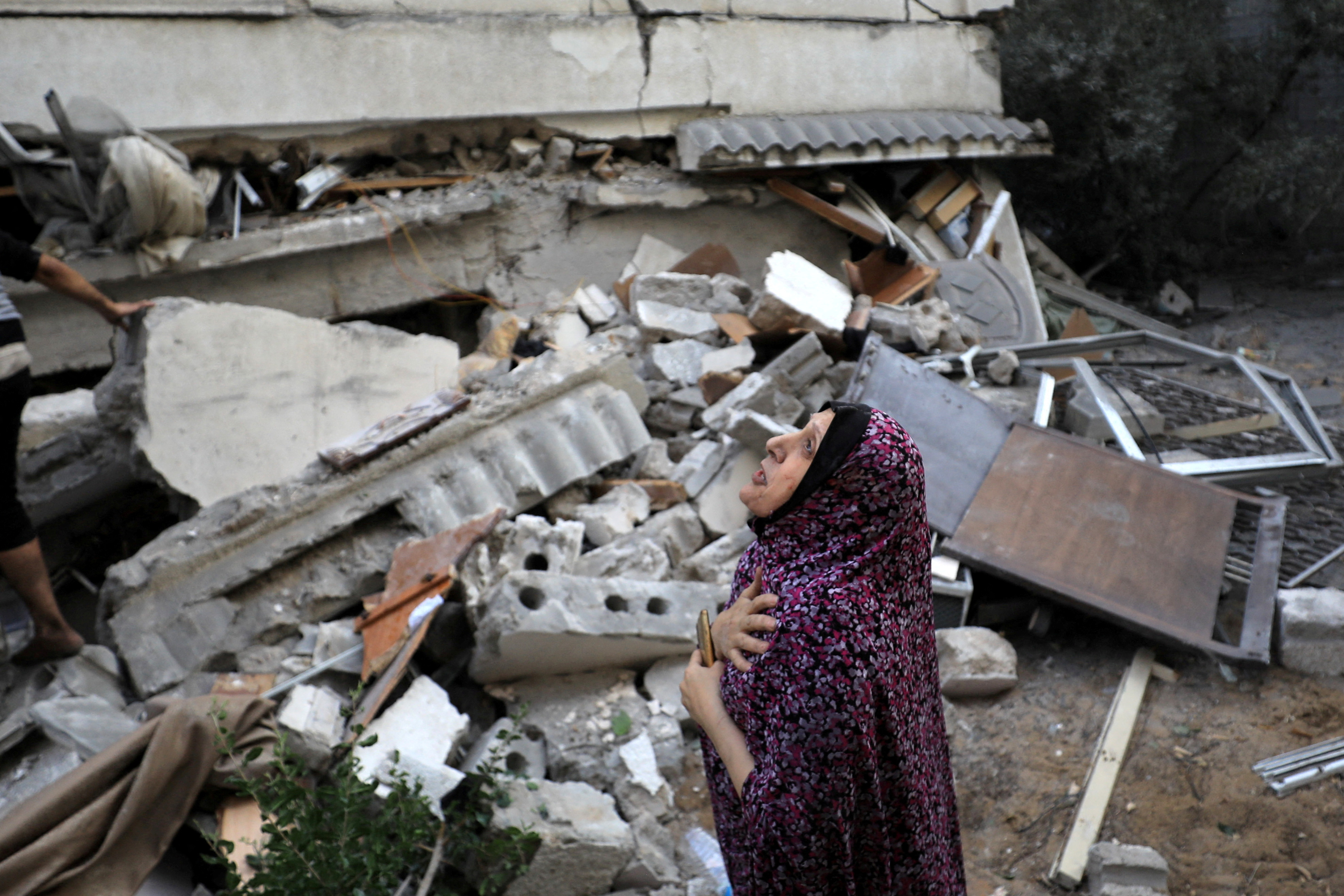 Palestinians work to rescue people at the site of an Israeli strike on a residential building in Gaza City