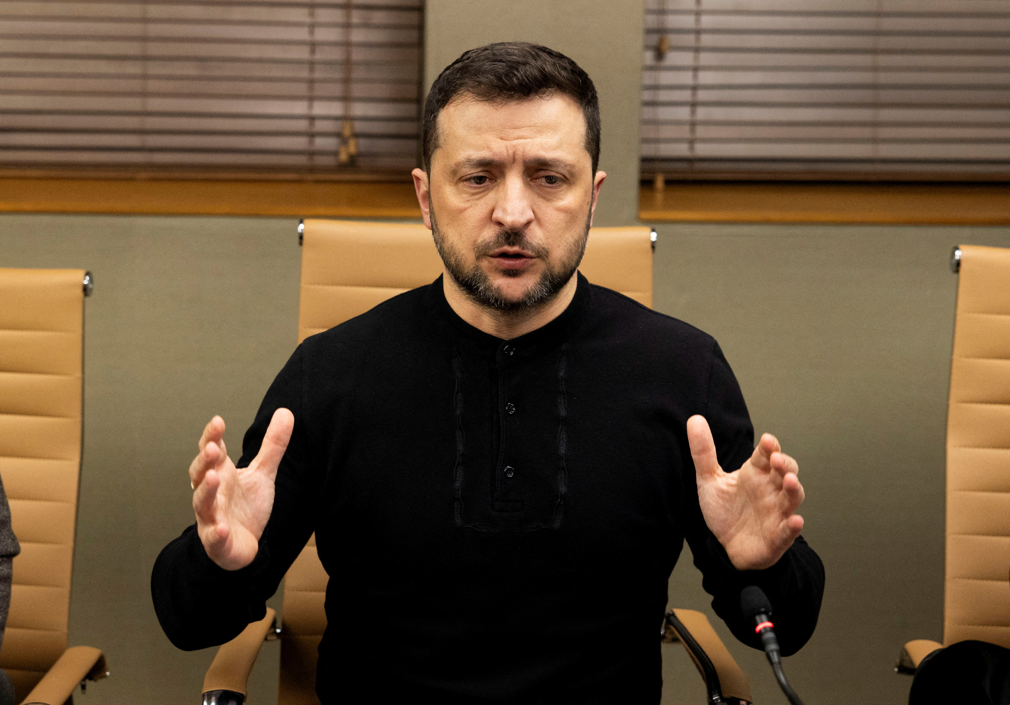 FILE PHOTO: Ukrainian President Volodymyr Zelenskiy speaks during a meeting with members of the media on the outskirts of  London