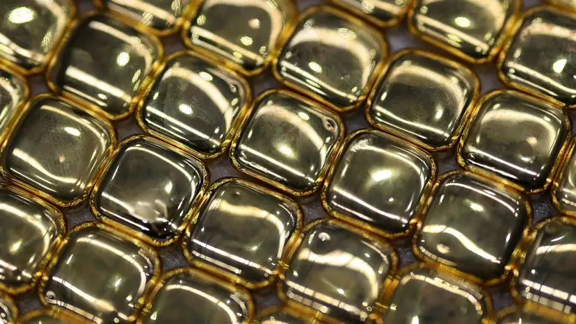 One-ounce gold bullion bars lie ready for stamping during production at ABC Refinery, in Sydney