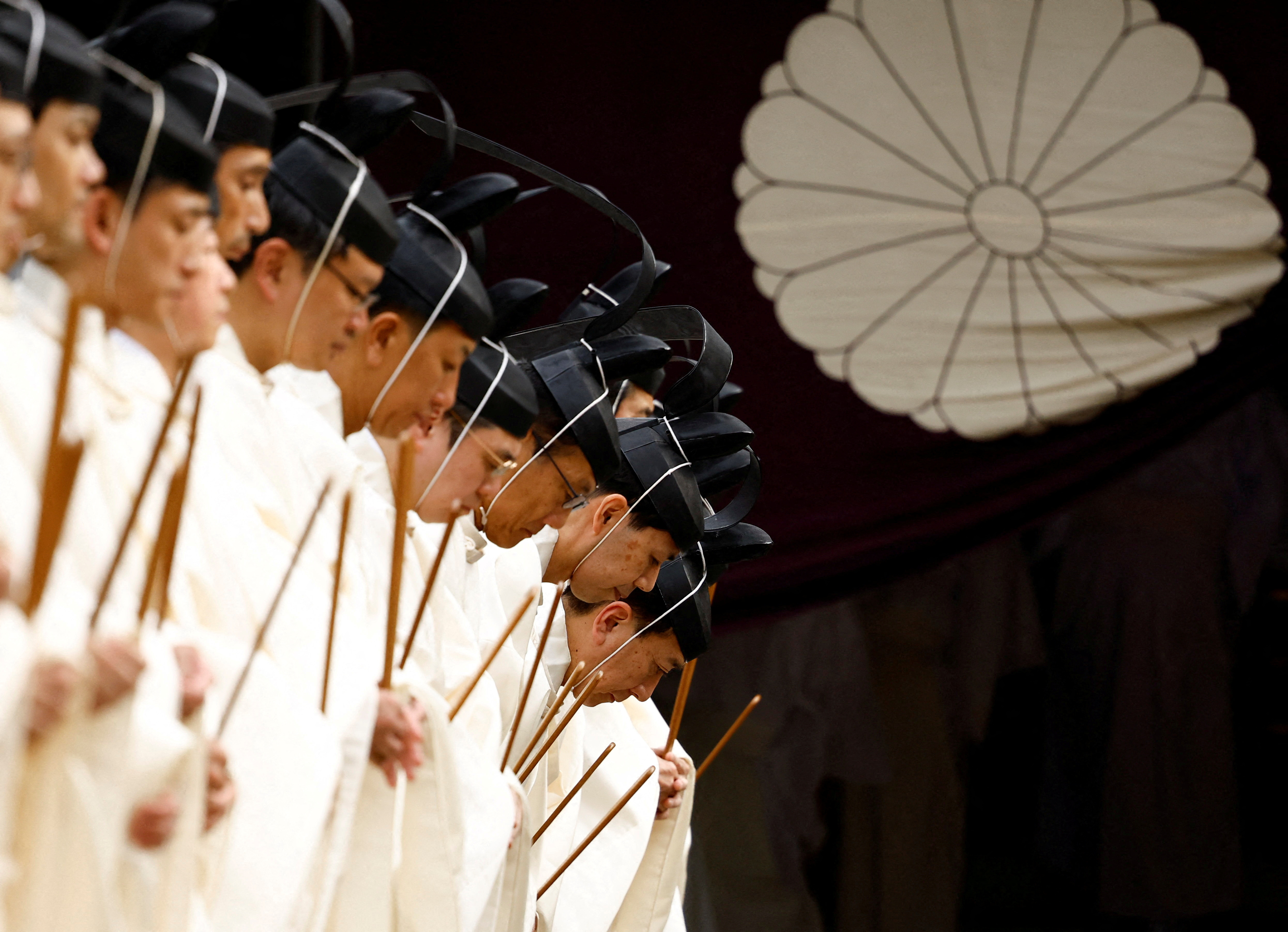 Japanese Shinto priests attend a ritual during an autumn festival at Yasukuni Shrine in Tokyo