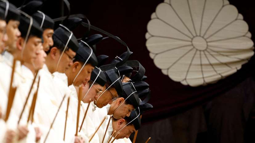 Japanese Shinto priests attend a ritual during an autumn festival at Yasukuni Shrine in Tokyo