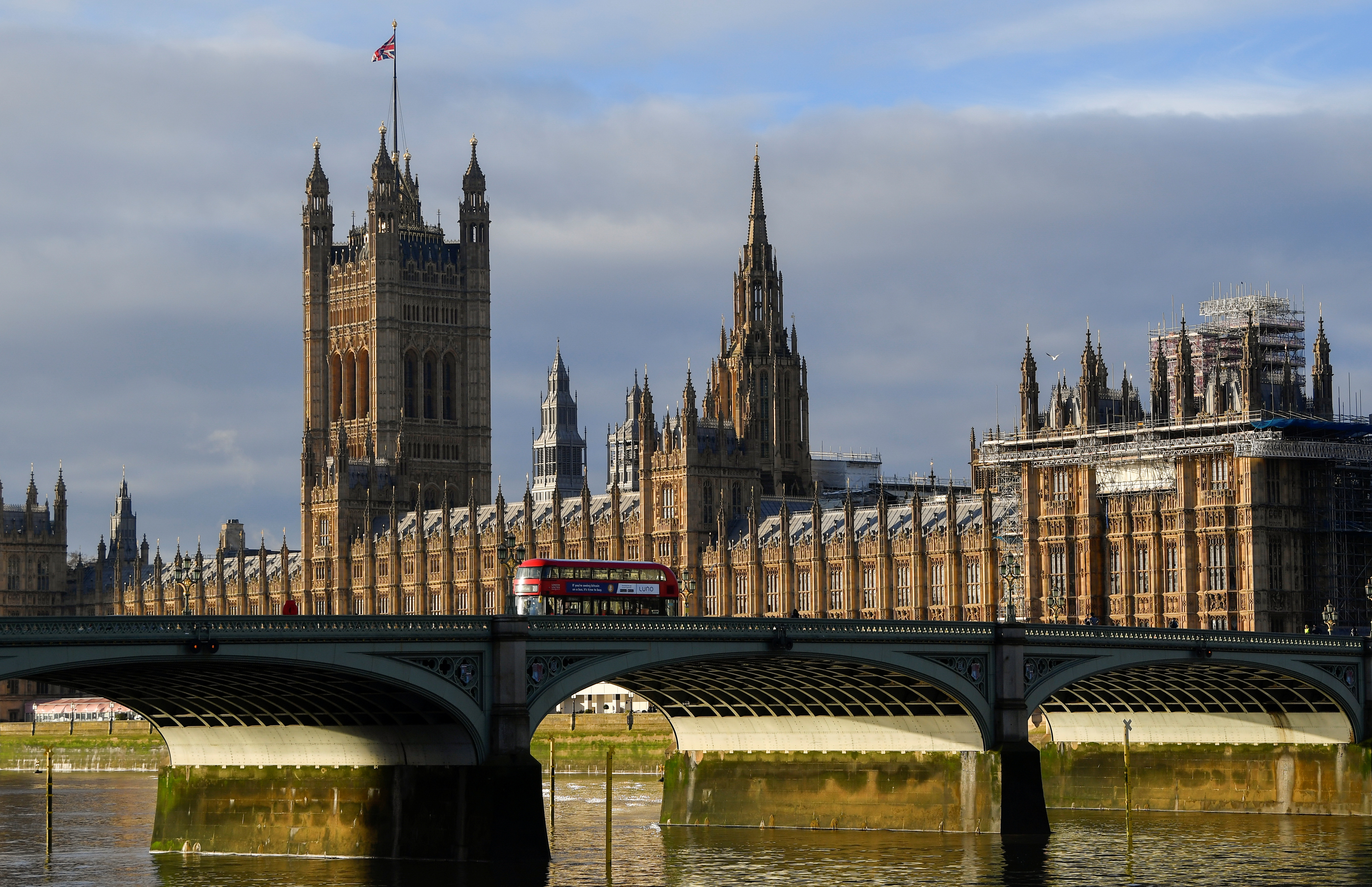 The British union flag flutters on the Victoria Tower at the Houses of Parliament, in London