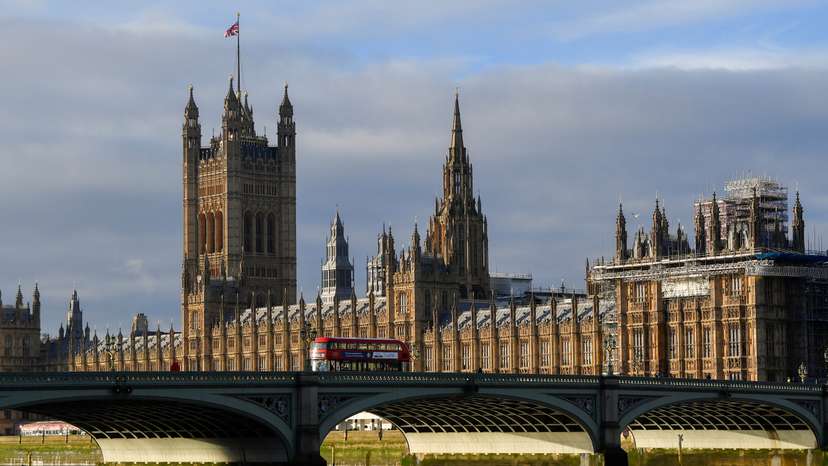 The British union flag flutters on the Victoria Tower at the Houses of Parliament, in London