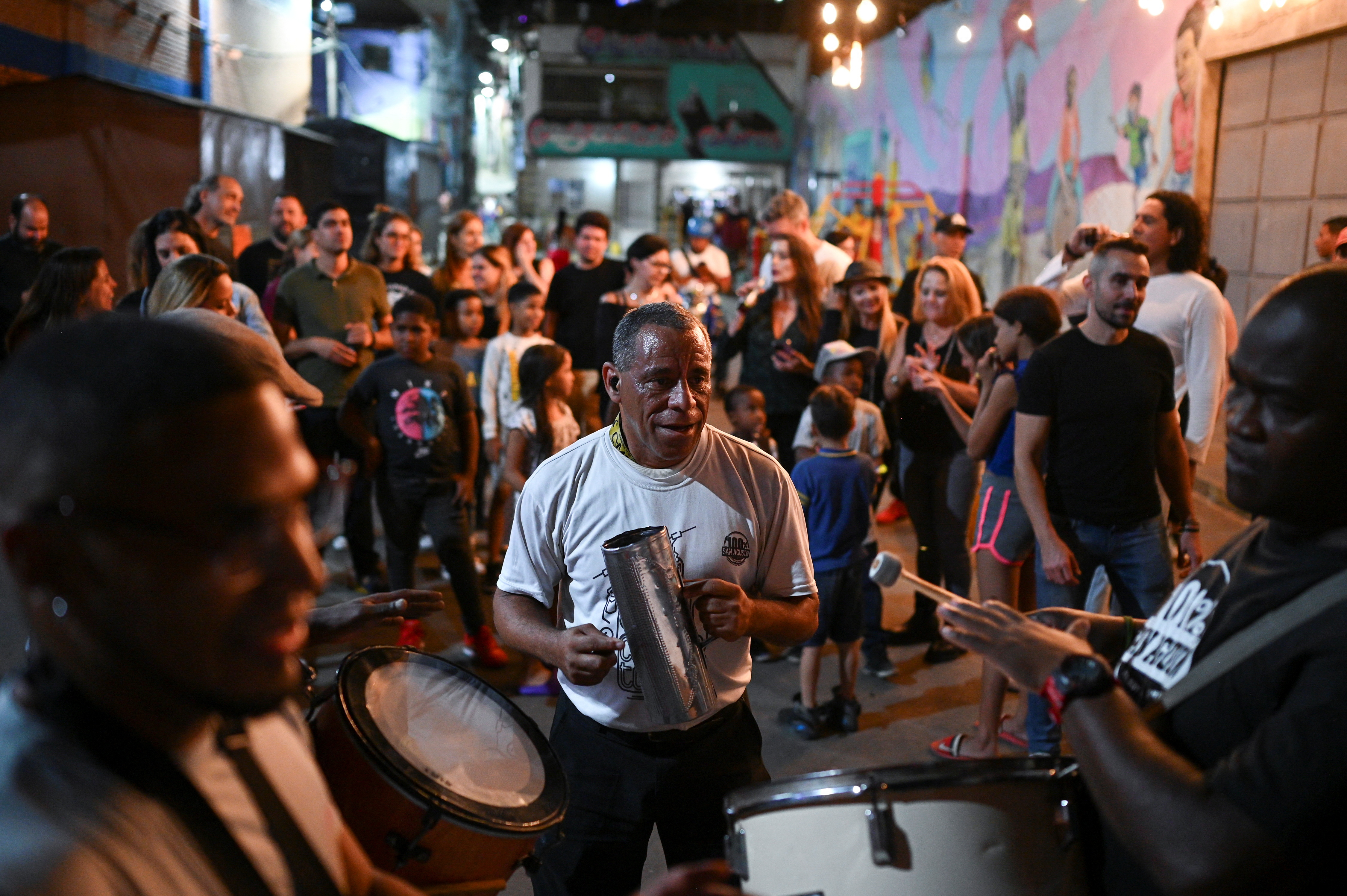 Bars offer food and dance routes to boost their economy, in Caracas