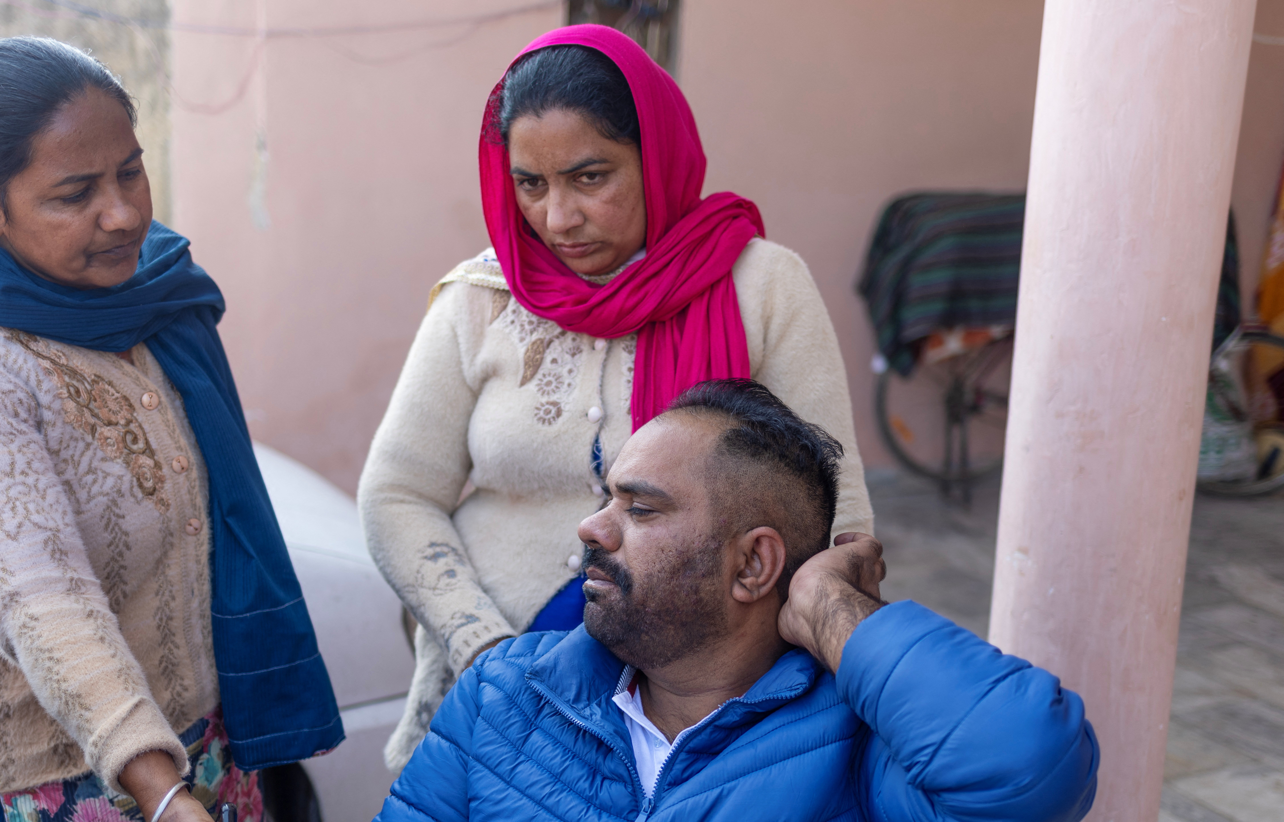 Daler Singh who was deported by U.S. authorities speaks with the media in Salempura