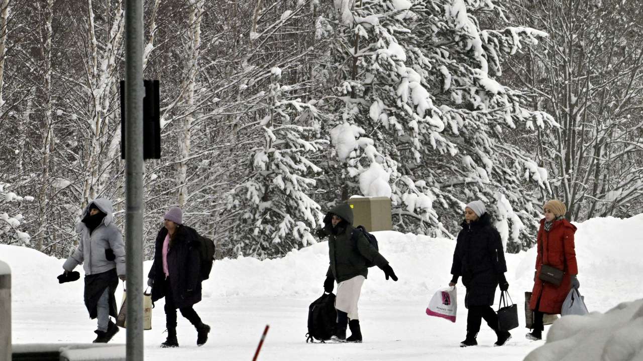 FILE PHOTO: Migrants arrive at the Vaalimaa border check point between Finland and Russia in Virolahti