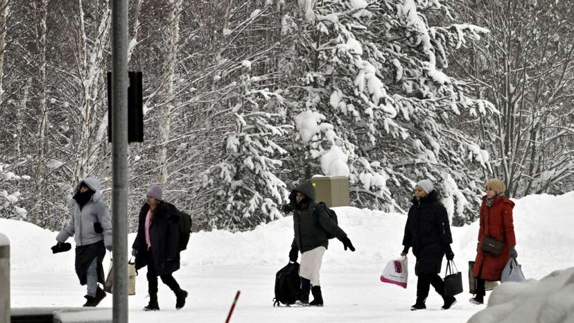 FILE PHOTO: Migrants arrive at the Vaalimaa border check point between Finland and Russia in Virolahti