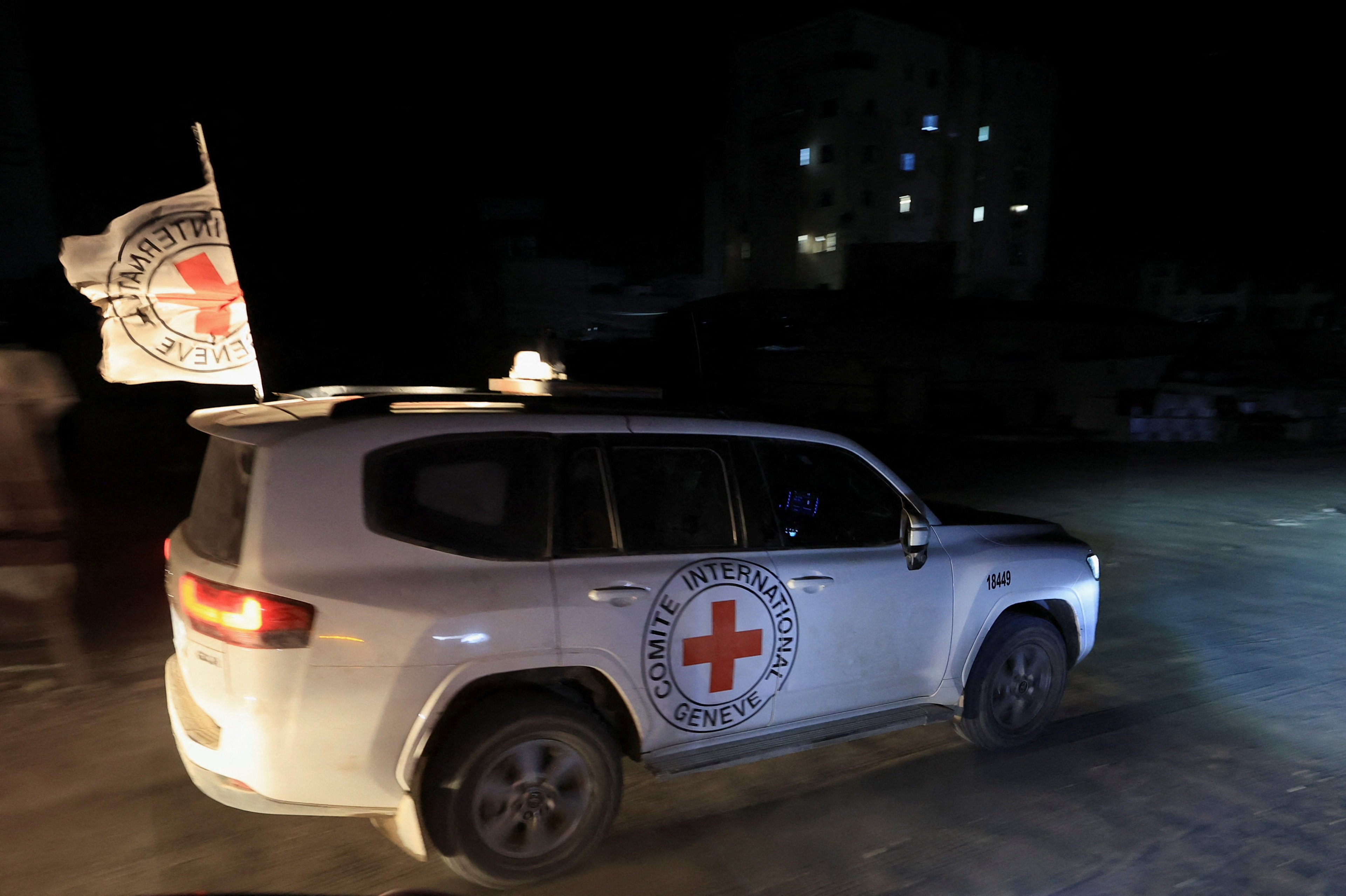 Red Cross transports the body of a deceased hostage after it was handed over by Hamas militants as part of a ceasefire and a hostages-prisoners swap deal between Hamas and Israel, in Gaza City