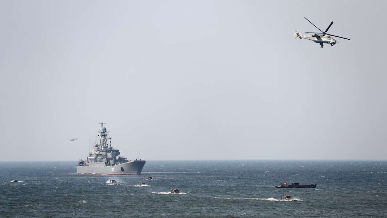 An amphibious assault ship, armored personnel carriers and helicopters are seen during military exercises of the Russian Navy in Kaliningrad Region